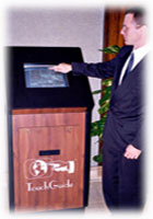 TouchGuide's inventor, Mark Metz, demonstrates a unit in a hotel lobby