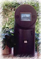 A TouchGuide Titania(TM) Series kiosk, designed for use in a high-traffic lobby area of a resort.  Note the coupon for an area restaurant being offered at the front of the unit. Stereo speakers in the faceplate provide the optimal user multimedia experience.